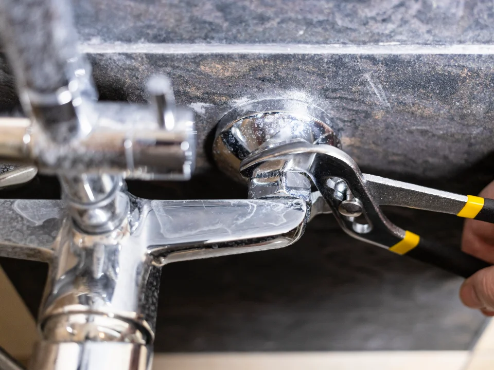 Plumber servicing a Fixture