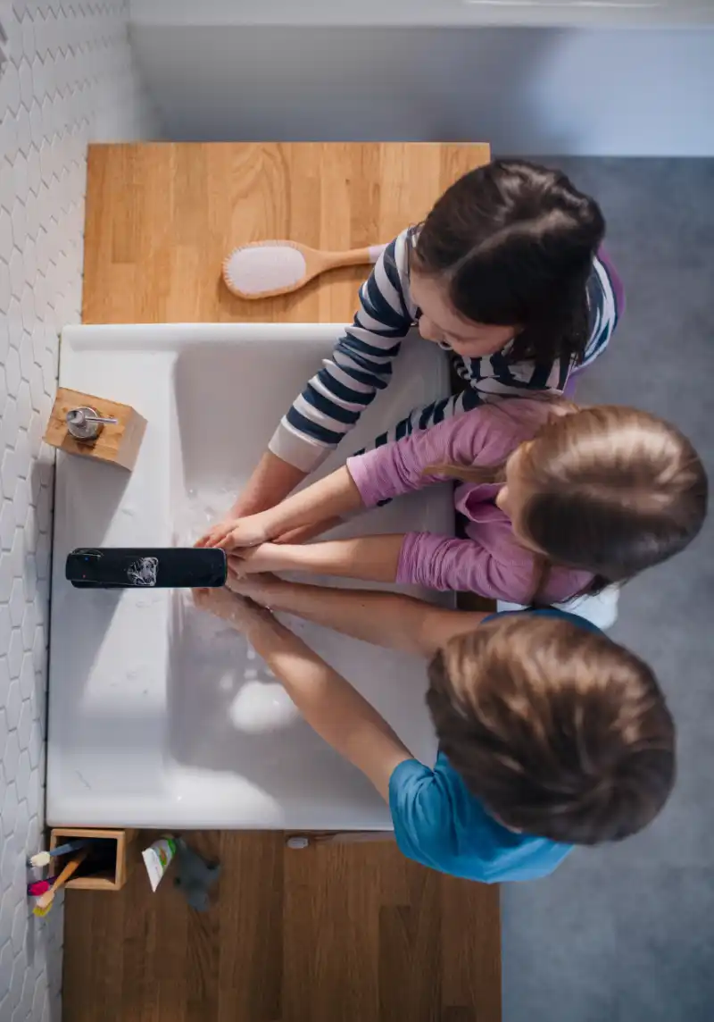 3 Kids washing their hands