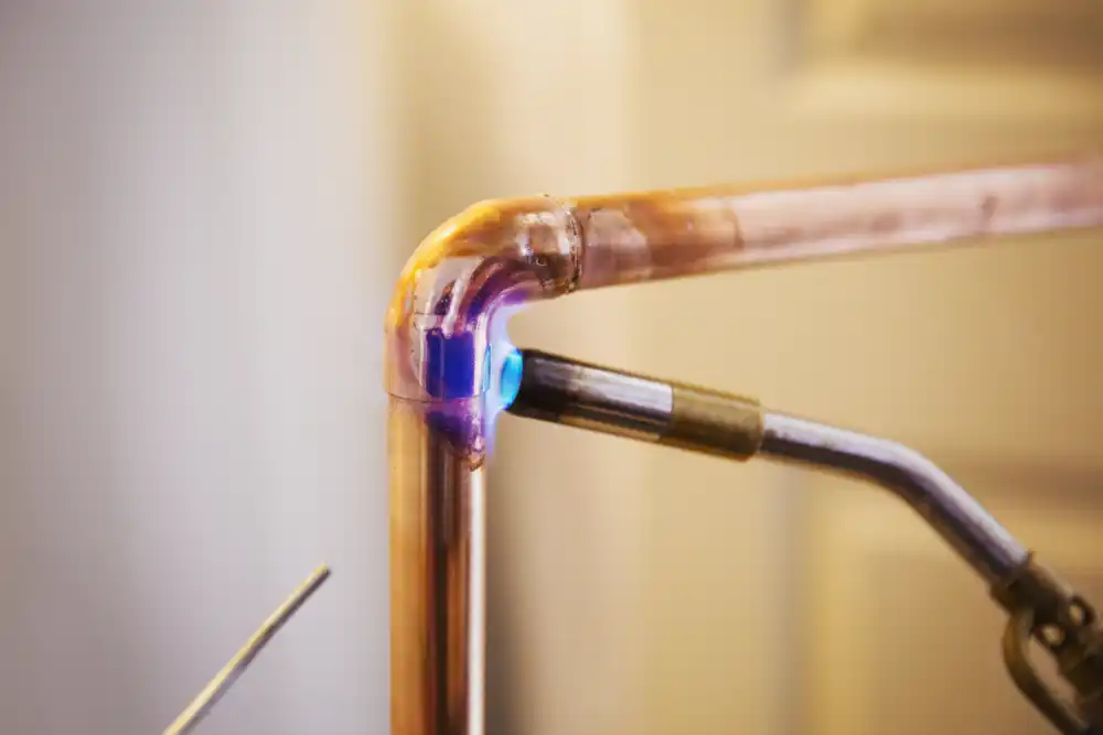 Close up of a copper pipe repair